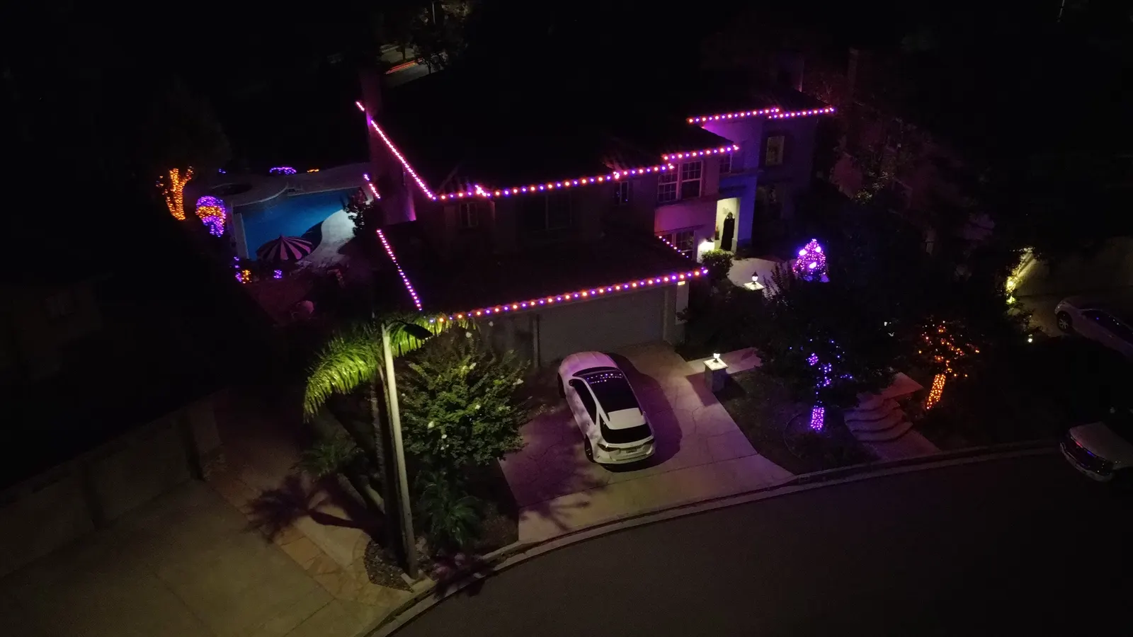Aerial view of Halloween roofline lighting installation